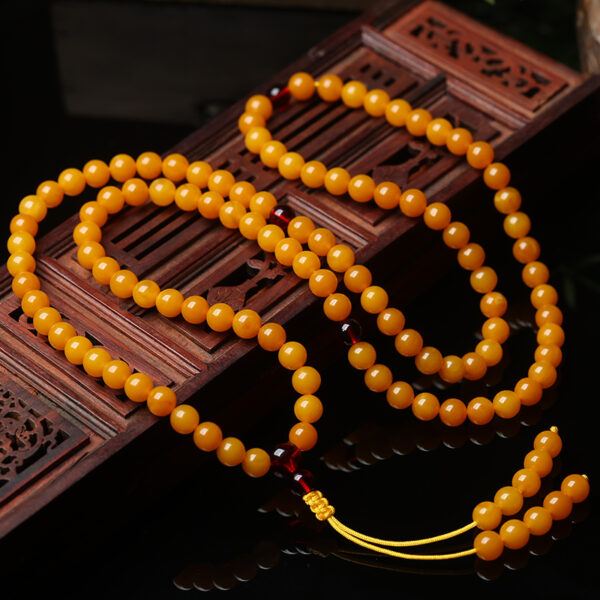 amber buddhist prayer beads.jpg